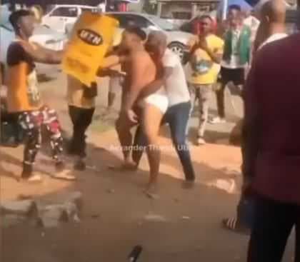 Suspected yahoo boy runs mad, pulls off clothes (Video)