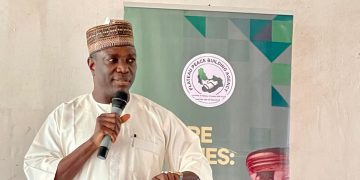 Deputy Governor Ngo Piyo Unveils PSPBA 10th Anniversary Logo at Peace Forum in Plateau