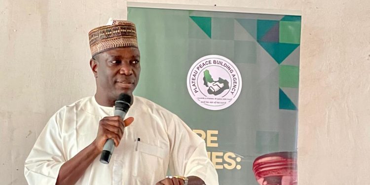 Deputy Governor Ngo Piyo Unveils PSPBA 10th Anniversary Logo at Peace Forum in Plateau